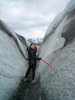 Visitor to Iceland walks on an icy crevasse Photo by Sarah Masters